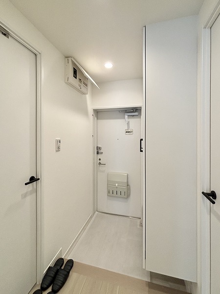 月島ホームズ_清潔感のある玄関の写真 