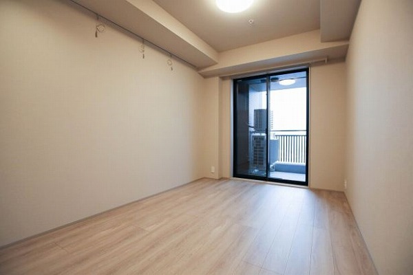 大崎ウエストシティタワーズE棟_メインのベットルームに最適な洋室の写真